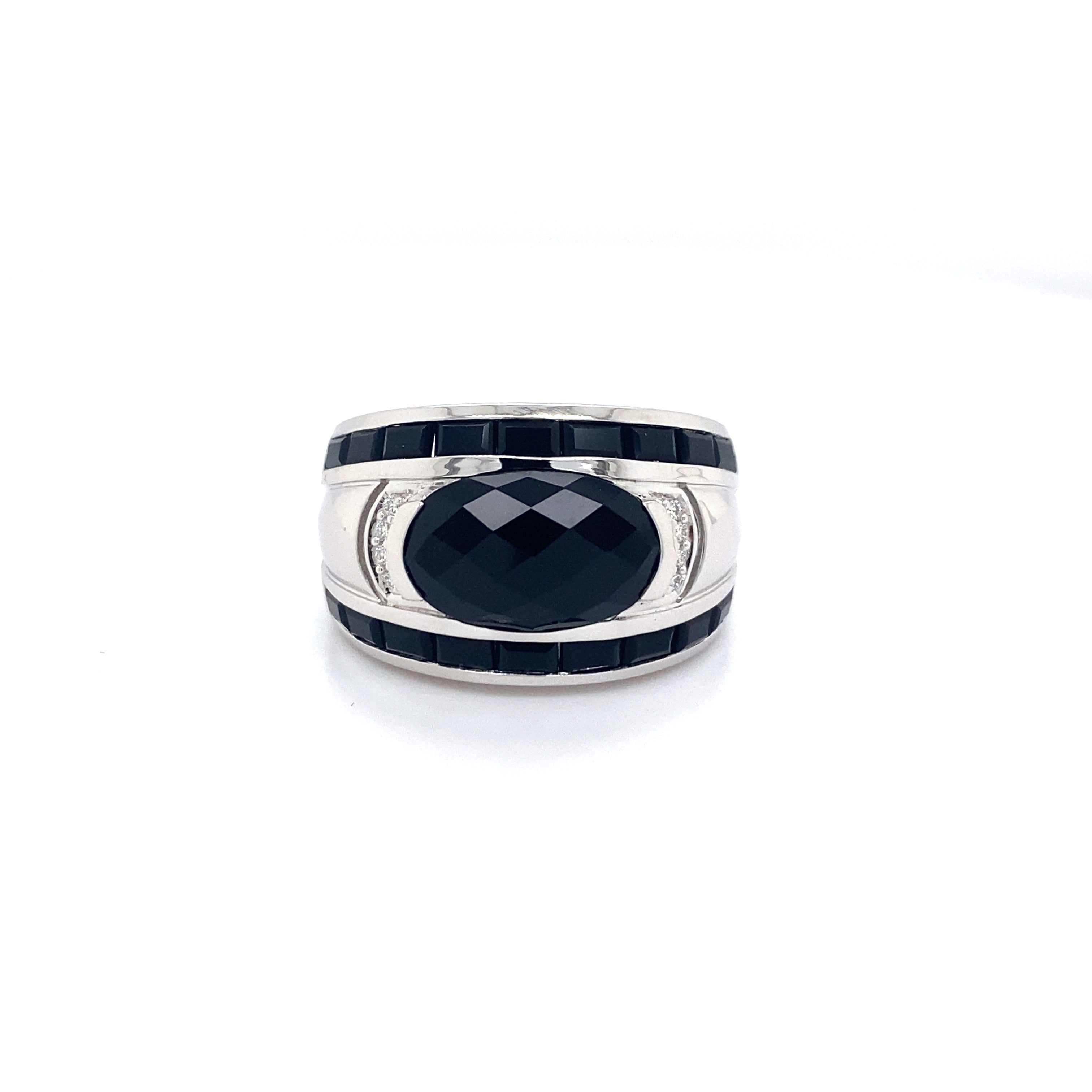 9ct white gold onyx and diamond dress ring.