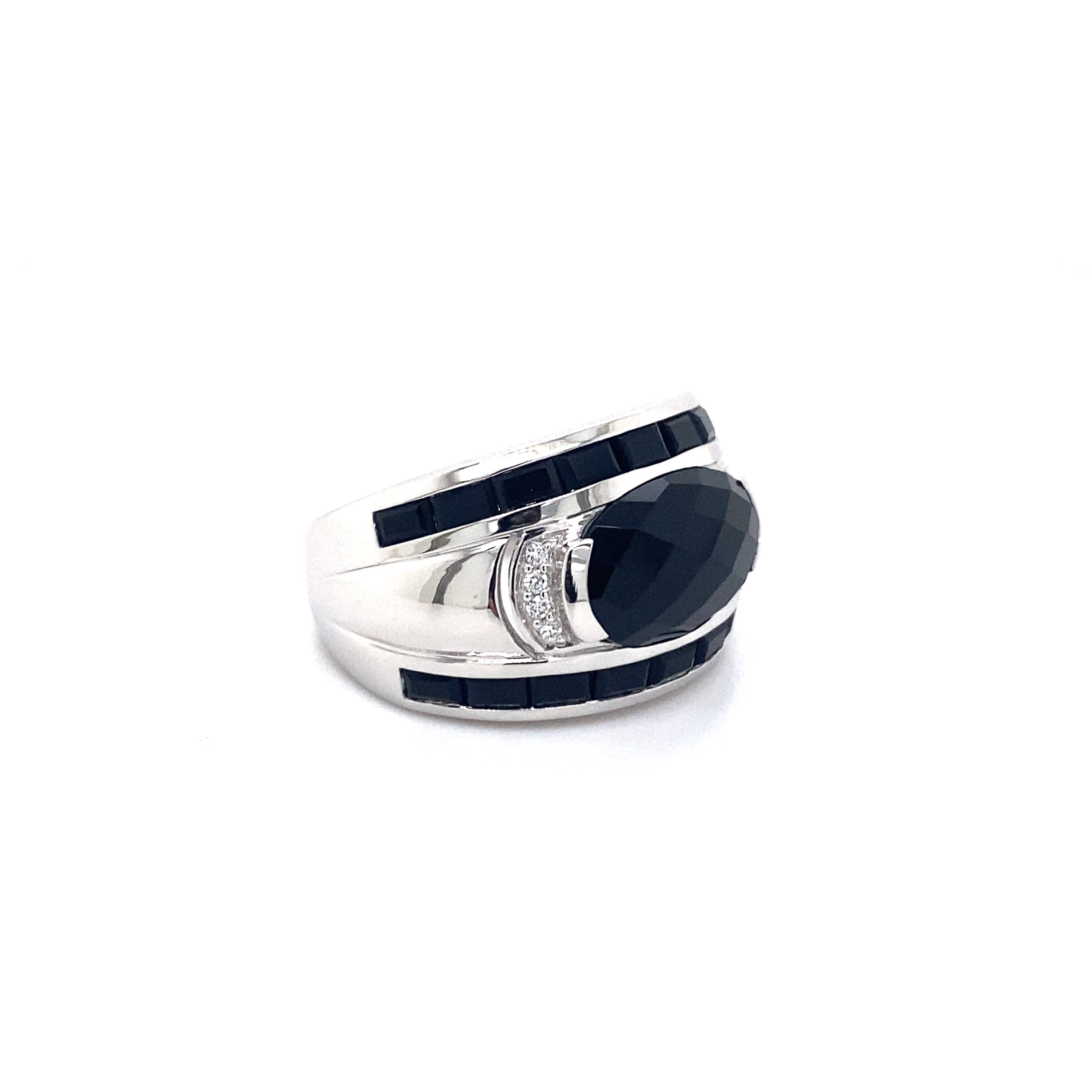 9ct white gold onyx and diamond dress ring.