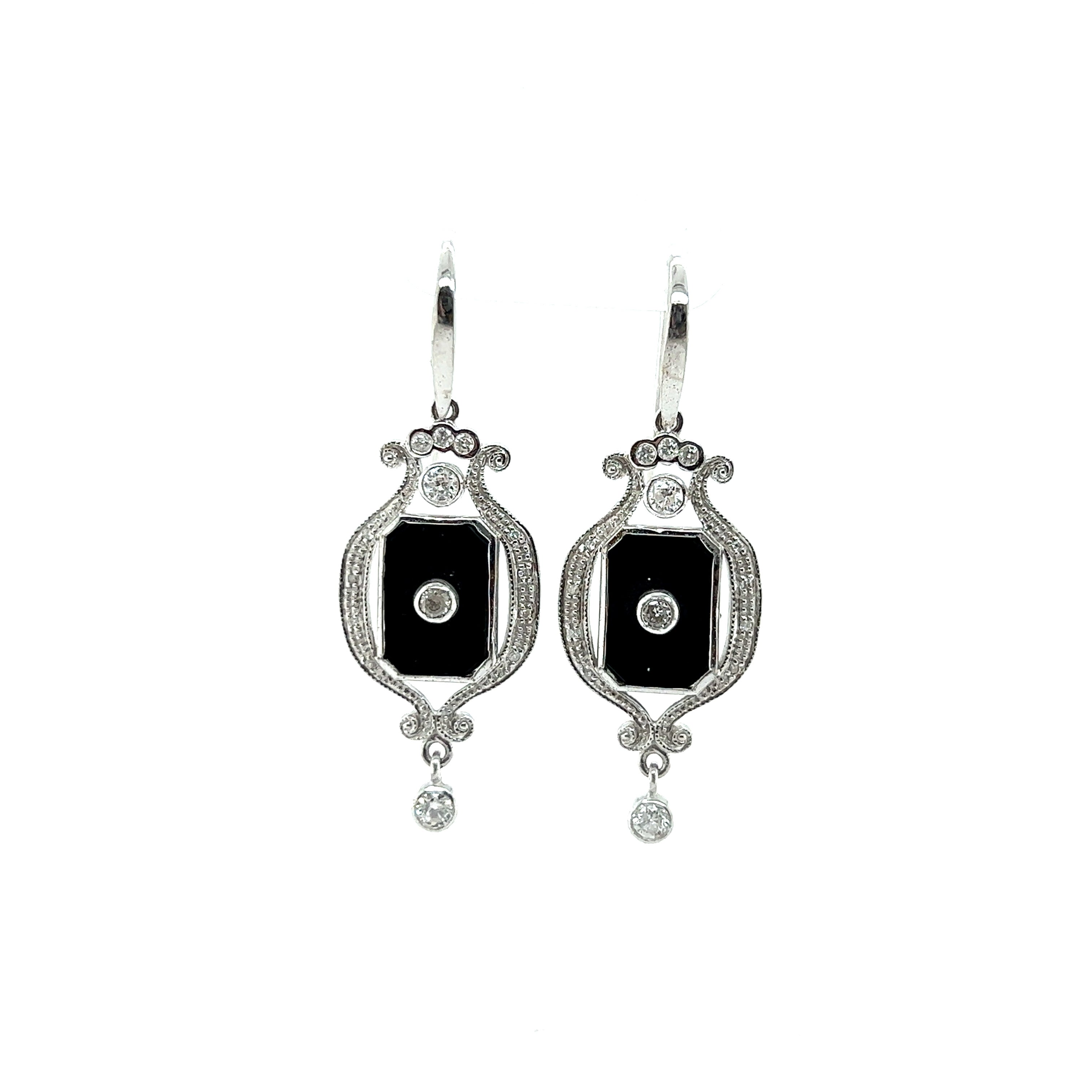 9ct white gold onyx and diamond earrings.