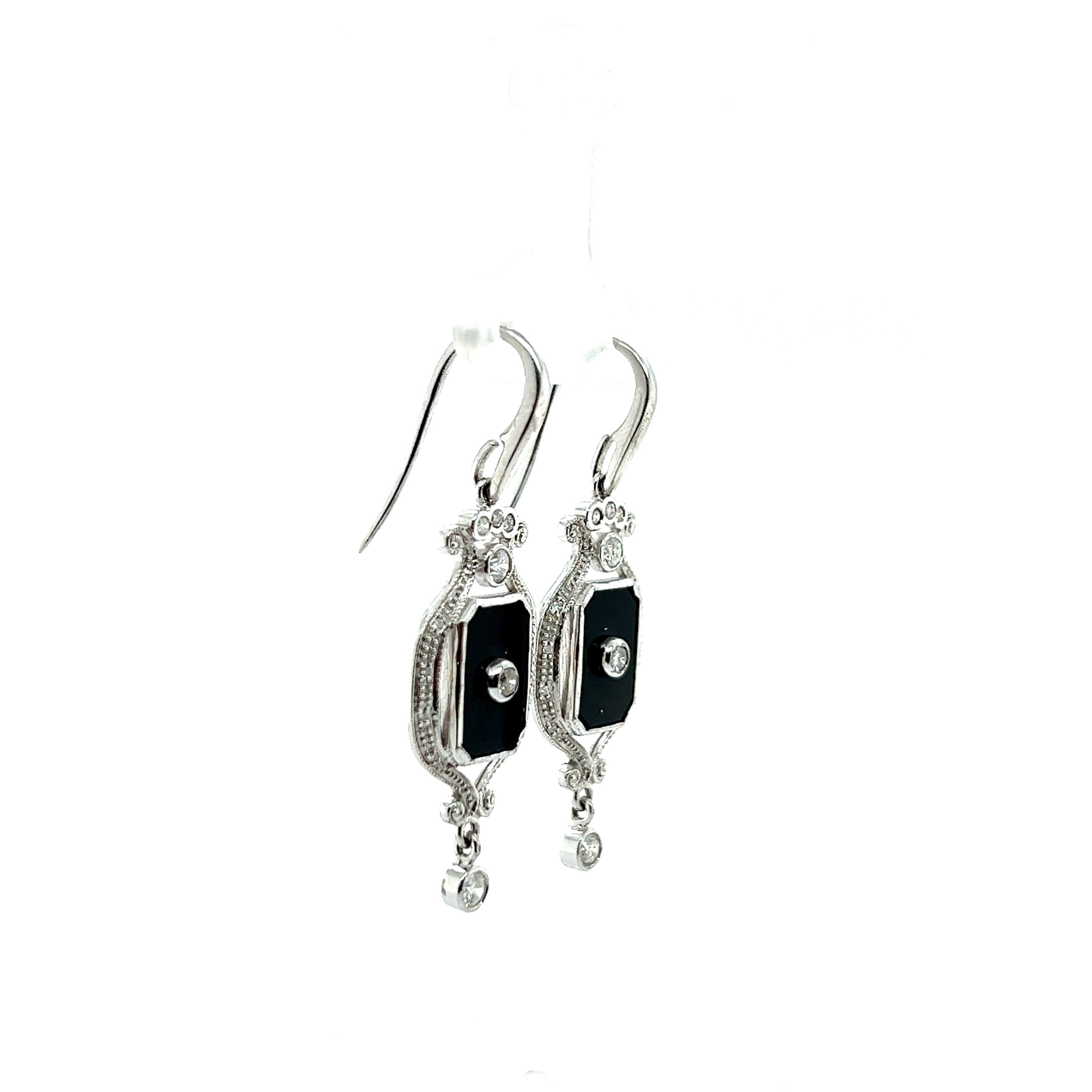 9ct white gold onyx and diamond earrings.