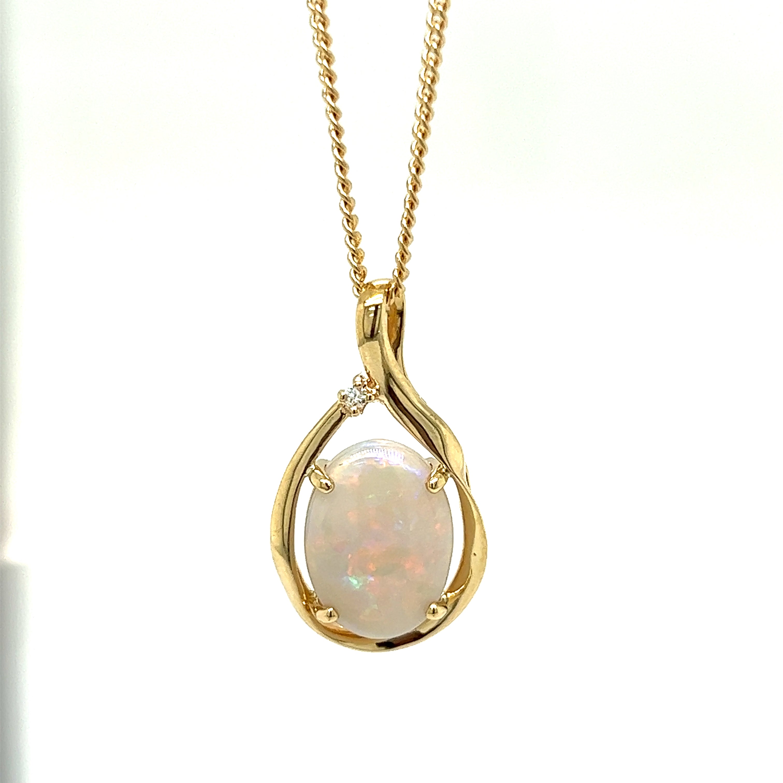 9ct yellow gold crystal opal and diamond pendant