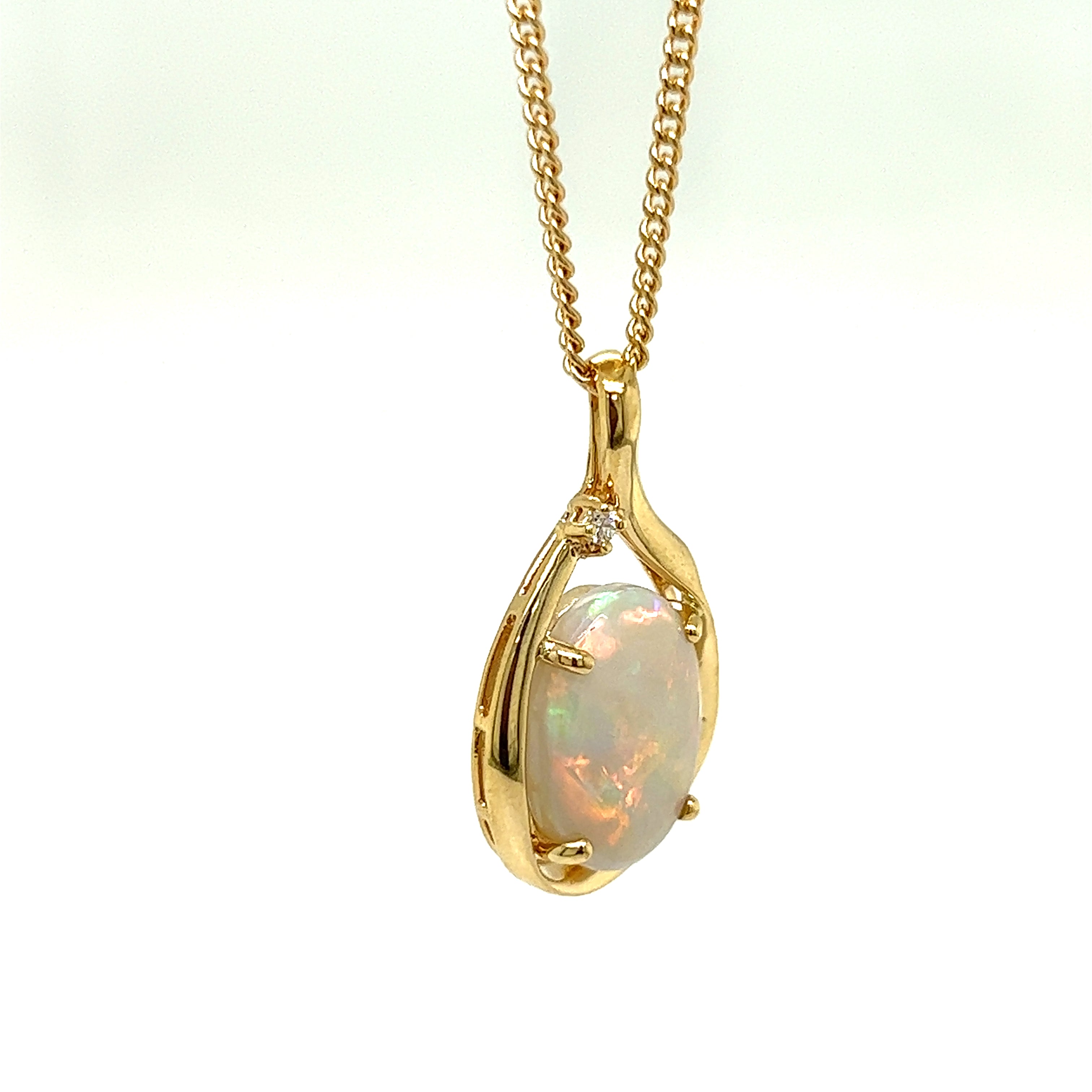 9ct yellow gold crystal opal and diamond pendant