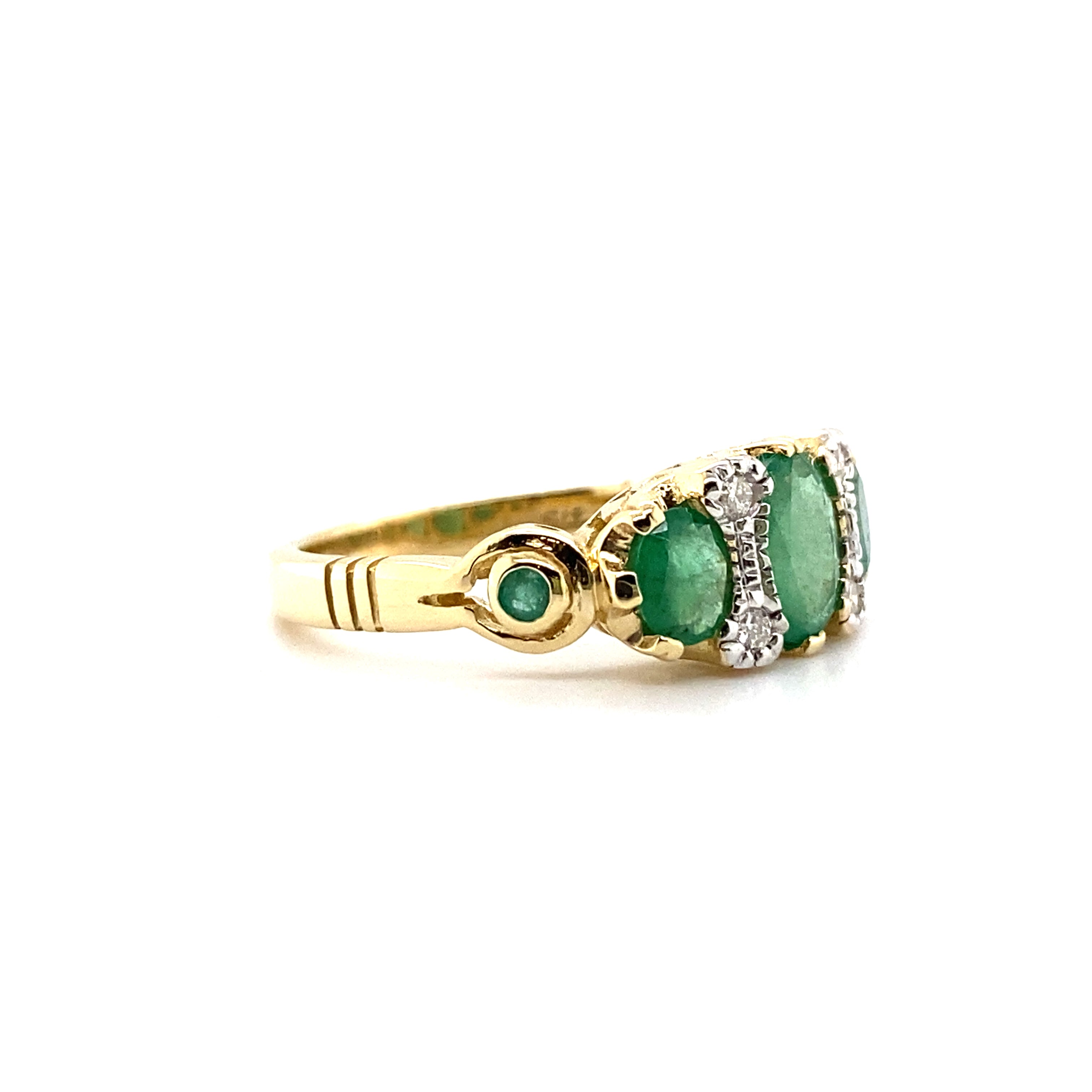 9ct yellow gold emerald and diamond ring.