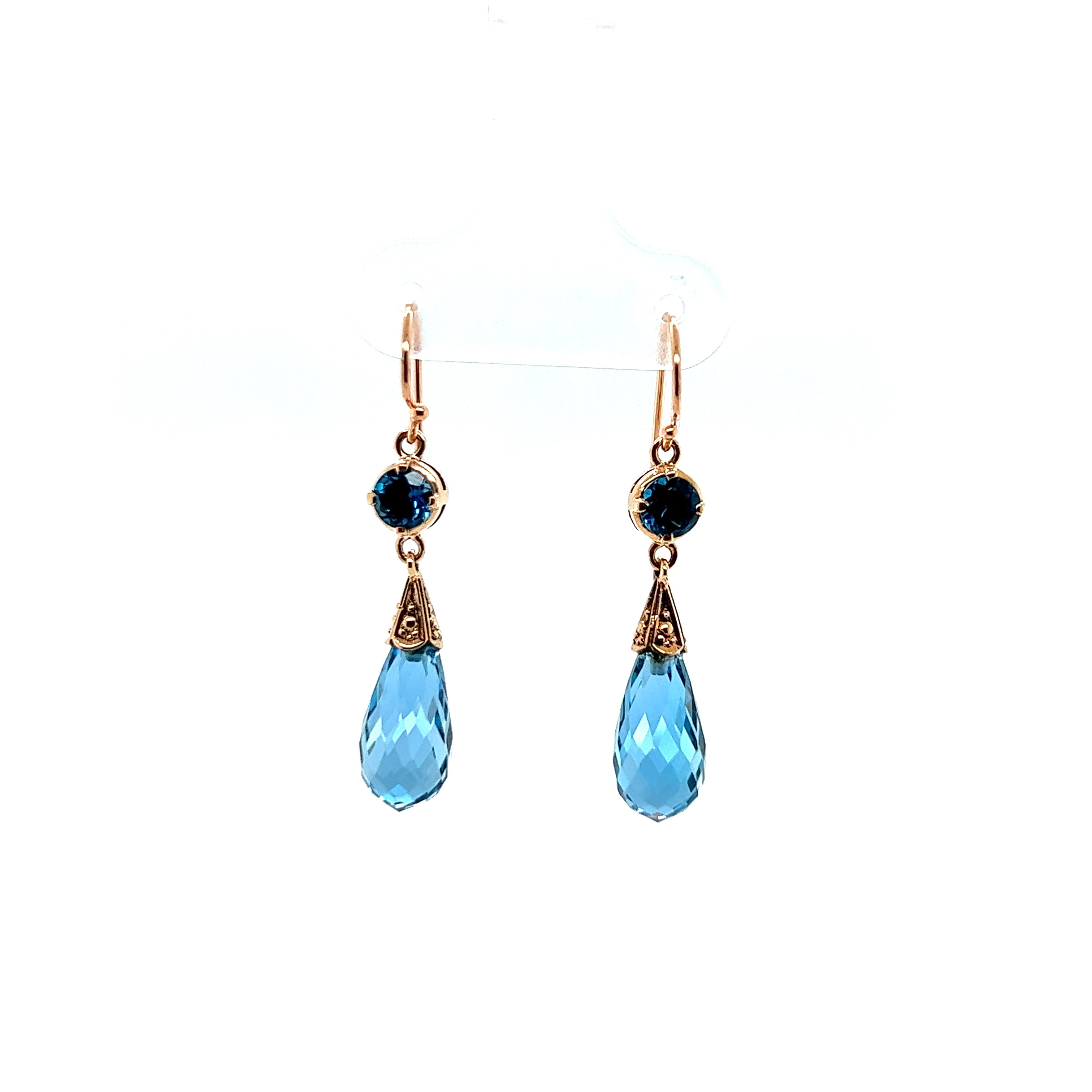 9ct rose gold briollette London blue topaz earrings.