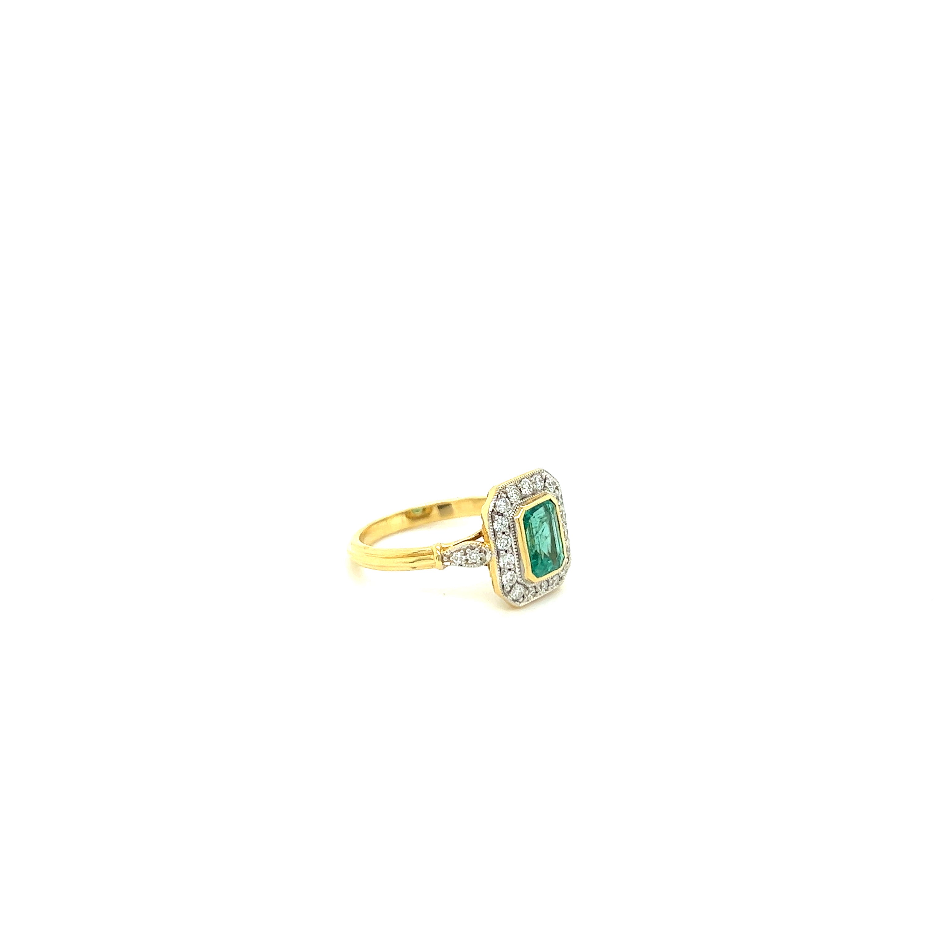 18ct yellow gold emerald and diamond ring.